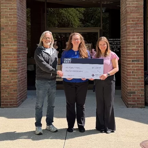 Troy team members present MSGCU's Giving Back donation to the Troy Police Department.